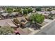Aerial view of a single Gathering home, showcasing solar panels and a well maintained front yard with mature landscaping at 10727 E El Moro Ave, Mesa, AZ 85208