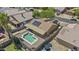 Aerial view of a private backyard featuring a sparkling pool and solar panels at 10727 E El Moro Ave, Mesa, AZ 85208