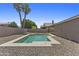 Backyard with a pool, gravel landscaping, and partial fence at 10727 E El Moro Ave, Mesa, AZ 85208