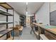 Large basement space with metal storage racks, and work areas at 10727 E El Moro Ave, Mesa, AZ 85208