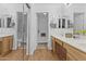 Bathroom boasts double sinks, wood vanity, and a separate shower at 10727 E El Moro Ave, Mesa, AZ 85208