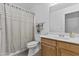 Cozy bathroom with a shower-tub combo, single sink vanity, and neutral color scheme at 10727 E El Moro Ave, Mesa, AZ 85208