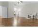 Bedroom features wood floors, white walls, and a ceiling fan at 10727 E El Moro Ave, Mesa, AZ 85208