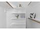 Bright closet space with adjustable shelving and clothes rods for ample storage solutions at 10727 E El Moro Ave, Mesa, AZ 85208