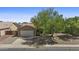 A single-story home with neutral stucco, a two-car garage, desert landscaping, and solar panels at 10727 E El Moro Ave, Mesa, AZ 85208