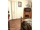 Bedroom with a wooden bookcase and closet door at 1231 E Avila Ave, Casa Grande, AZ 85122