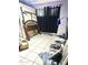 Bedroom with a bed frame, mattress, dark curtains, and tile floors at 1231 E Avila Ave, Casa Grande, AZ 85122