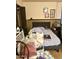 This bedroom features a gray padded headboard and some storage at 1231 E Avila Ave, Casa Grande, AZ 85122