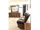 A bedroom featuring a rocking chair and a dresser with a mirror at 1231 E Avila Ave, Casa Grande, AZ 85122
