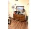 Bedroom with a wooden dresser with mirror, and a closet door at 1231 E Avila Ave, Casa Grande, AZ 85122