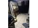 Bedroom with a bed frame, mattress, dark curtains, and tile floors at 1231 E Avila Ave, Casa Grande, AZ 85122