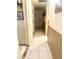 Hallway featuring tile flooring and a closet for storage at 1231 E Avila Ave, Casa Grande, AZ 85122