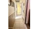 Hallway with tile flooring and a closet for storage at 1231 E Avila Ave, Casa Grande, AZ 85122