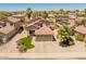 Aerial view of a well-maintained home with desert landscaping, red tile roof, and solar panels at 1374 E 10Th Pl, Casa Grande, AZ 85122