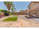Well-sized backyard with palm trees and low maintenance landscaping for easy outdoor enjoyment at 1374 E 10Th Pl, Casa Grande, AZ 85122