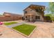 The backyard offers low-maintenance landscaping and hardscape design with a covered patio for outdoor enjoyment at 1374 E 10Th Pl, Casa Grande, AZ 85122