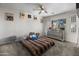 Bedroom with carpeted floors, ceiling fan, and a large window overlooking the exterior at 1374 E 10Th Pl, Casa Grande, AZ 85122