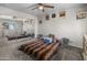 Bedroom features mirror closet doors, carpet floors, ceiling fan, and a window at 1374 E 10Th Pl, Casa Grande, AZ 85122