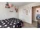 Bedroom with carpeted floors, and decorated walls at 1374 E 10Th Pl, Casa Grande, AZ 85122