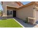 Charming home featuring a well-kept lawn and stone accents on the facade with attached two-car garage at 1374 E 10Th Pl, Casa Grande, AZ 85122