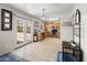 Open kitchen with stainless steel appliances, wood cabinetry, and double French doors leading to the yard at 1374 E 10Th Pl, Casa Grande, AZ 85122