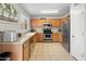 Well-lit kitchen featuring stainless steel appliances, tile flooring and wooden cabinets at 1374 E 10Th Pl, Casa Grande, AZ 85122