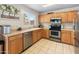 Bright kitchen with tile floors, stainless appliances, and a window providing natural light at 1374 E 10Th Pl, Casa Grande, AZ 85122