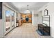 Kitchen features stainless appliances, light-colored cabinets, tile floors, and French doors to backyard at 1374 E 10Th Pl, Casa Grande, AZ 85122