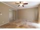 Spacious bedroom with tile flooring, a ceiling fan, and a mirrored closet at 1401 E Puget Ave # 24, Phoenix, AZ 85020