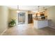 Eat-in kitchen featuring granite countertops, stainless appliances, and a sliding glass door to the outside at 1401 E Puget Ave # 24, Phoenix, AZ 85020