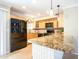 Beautiful kitchen featuring granite countertops, stainless appliances, and light wood cabinets at 1401 E Puget Ave # 24, Phoenix, AZ 85020