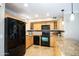 Kitchen featuring granite countertops, stainless appliances, and light wood cabinets at 1401 E Puget Ave # 24, Phoenix, AZ 85020