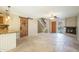 Spacious living room boasting tile floors, fireplace, staircase, and a decorative sliding door at 1401 E Puget Ave # 24, Phoenix, AZ 85020