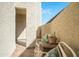 Private patio area with seating and stucco walls offering a relaxing outdoor space at 1401 E Puget Ave # 24, Phoenix, AZ 85020