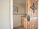 Half bathroom featuring updated vanity and wooden door with rustic iron decor at 1401 E Puget Ave # 24, Phoenix, AZ 85020