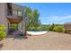 The backyard features a pool, desert landscaping, a spiral staircase and desert surroundings at 1419 E Las Palmaritas Dr, Phoenix, AZ 85020