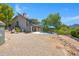 Backyard features a pool, patio, desert landscaping, a spiral staircase, and surrounding desert views at 1419 E Las Palmaritas Dr, Phoenix, AZ 85020