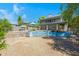 Expansive backyard features a large house with upper and lower patios, a desert landscape and a pool at 1419 E Las Palmaritas Dr, Phoenix, AZ 85020