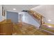 Inviting basement space showcases tile flooring, a staircase, and access to other rooms at 1419 E Las Palmaritas Dr, Phoenix, AZ 85020
