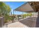 Inviting deck features a shade cover and string lights with serene neighborhood views and a community pool at 1419 E Las Palmaritas Dr, Phoenix, AZ 85020