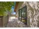 An outdoor deck with a sliding door, surrounded by trees, offering a private and tranquil retreat at 1419 E Las Palmaritas Dr, Phoenix, AZ 85020