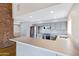 Modern kitchen featuring stone counters, eat in bar area, and stainless steel appliances at 1419 E Las Palmaritas Dr, Phoenix, AZ 85020