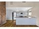 Modern kitchen featuring stainless steel appliances, stone counters, and eat in bar area at 1419 E Las Palmaritas Dr, Phoenix, AZ 85020