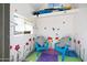 Playful shed interior with cheerful decor, including colorful walls, and comfortable seating, a creative retreat at 1419 E Las Palmaritas Dr, Phoenix, AZ 85020