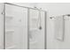 Bathroom featuring sleek shower with glass doors and modern fixtures, offering a spa-like experience at 14360 W Pershing St, Surprise, AZ 85379