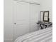 Bedroom with large closet, modern keyboard and mirror, offering storage and functionality at 14360 W Pershing St, Surprise, AZ 85379