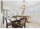 An open floor plan features a living room and dining area, with neutral colors and plenty of light at 14360 W Pershing St, Surprise, AZ 85379