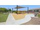 Community playground featuring play structures, a shade, and seating, perfect for Gathering fun at 14360 W Pershing St, Surprise, AZ 85379