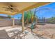 Spacious backyard under covered patio, featuring a playset, providing a fun outdoor space at 14808 N 37Th Way, Phoenix, AZ 85032