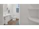Clean and bright bathroom featuring a pedestal sink, toilet, and tiled floor at 14808 N 37Th Way, Phoenix, AZ 85032
